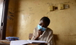 A final year students of Agidinbi Senior Grammar School,Ikeja, Lagos, wearing a facemask w...