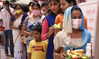 Devotees visit a Ganesh Temple wearing mask on the occasion of Ganesh Chaturthi, amid the...