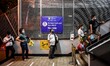 People queue at a train station in Manila, Philippines on August 26, 2020. An 8:00 p.m. to...