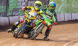 Luke Harrison (Blue) and Max James (Yellow) tangle on the back straight (250cc Class) duri...