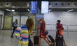 A few passengers and a few flight attendants seen in a nearly empty Terminal Hall at Krako...