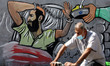 A Palestinian man wearing a protective mask walks past a mural depicting prisoner Maher Al...