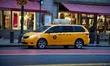 Iconic yellow taxi stationary inline queued and moving on the streets of Midtown Manhattan...