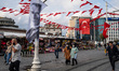 People celebrate the Republic Day of Turkey with Turkish flags and photos of Ataturk on Oc...