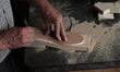 A carpenter makes a wooden sandals in his workshop in the old town of Nablus city West Ban...