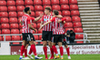  Max Power celebrates with his team mates after scoring his sides first goal of the match...