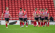  Max Power celebrates with his team mates after scoring his sides first goal of the match...