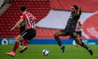  Cameron Jerome stretches for the ball against Bailey Wright during the Sky Bet League 1 m...