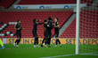 Scott Fraser celebrates with team mates after scoring MK Dons penaltyduring the Sky Bet Le...
