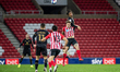  David Kasumu wins a header during the Sky Bet League 1 match between Sunderland and MK Do...