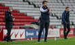  √Russell Martin MK Dons Manager giving instructions to his team during the Sky Bet League...