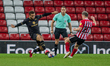  Grant Leadbitter and Carlton Morris clash during the Sky Bet League 1 match between Sunde...