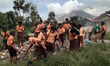 
Elementary school kids playing in the area as a place of learning with the Sinabung volc...