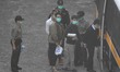 (L) Ivan Lam (R) Joshua Wong is seen entering a prison van at Lai Chi Kok Reception Centre...