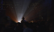 The lights of a performance creating a silhouette of a person  at the Parkife 2015 festiva...