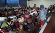 An image available on June 8, 2015, Villagers rest in temporary shelters after they were e...