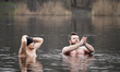 Participants or "walruses" are seen taking part in the traditional New Year's cold water s...