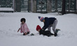 Children play in snow after heavy snowfall as snowfall contimues for third day in Srinagar...