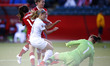 (150612) -- EDMONTON, June 12, 2015 () -- New Zealand's Rosie White (3rd L) makes a threat...