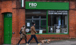People walking by an FBD Insurance branch in Dublin city center during Level 5 Covid-19 lo...