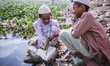 two Madrassha students happily playing with flowers 