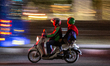 An Indonesian driver of ride-hailing service Gojek and his passenger commute in Jakarta 5...