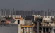 Kids are seen on a residential building in Dwarka, area of New Delhi, India on 19 March 20...