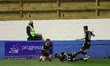Grimsby Town's  Luke Spokes celebrates with Rollin Menayese and Harry Clifton after scorin...