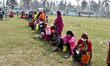 oters wait in queue to cast their ballots at a polling station during Phase 1 of Assam's l...