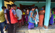 Tribal karbi voters  queue up to cast their ballots during  second  phase polling  for Ass...