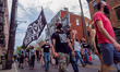 A man holds a Black Lives Matter flag as people gather at Washington Park in memorial and...