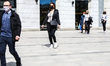 People are walking on the street on the first day of shops and service points fully open a...