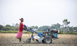 A farmer uses a power tiller in a field on the outskirts of Dhaka on May 30, 2021.  