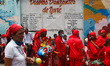 Dancing Devils rest during the Corpus Christi celebration amidst the Coronavirus pandemic...