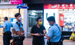 A man with yellow mask and black outfit is controlled by police in Causeway Bay. Police wa...