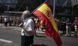People wave Spanish flags during a protest by right-wing protesters to denounce controvers...