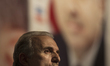 Aziz Babuscu, AKP's Istanbul regional head, speaks to supporters at the party headquarters...