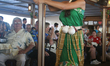 Hawaiian dancer entertains tourists aboard a cruise ship off the coast of the Hawaiian isl...