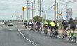 Group of bicyclists travel along a busy road in Toronto, Ontario, Canada. 