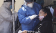 A Mexican citizen undergoes an antigen rapid  test at a Covid-19 test site to detect the S...