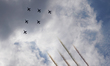 The Blue Impulse Japan Air Self-Defense Force aerobatic display team flies over the sky in...