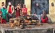 Devotees of Guru Osho attend the cremation of a loved one at Pashupatinath in Kathmandu, N...