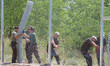 MORAHALOM, July 17, 2015 () -- Hungarian soldiers build the first section of the fence to...