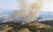Panoramic Aerial Bird's Eye view from a drone of the wildfire flames burning Evia Island,...