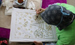 People with disabilities are trained in batik in the hall of Balai Pustaka building, Palme...