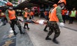 Libis, Quezon City Philippines - An injured man is rushed to an ambulance during the natio...