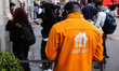 Just Eat logo is seen on a courier's jacket in Milan, Italy on October 6, 2021. 