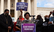 Congresswoman Sheila Jackson Lee, Democrat of Texas, raises a Build Back Better sign as sh...