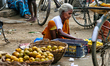 Woman selling fruits along the roadside in Madurai, Tamil Nadu, India, on August 29, 2017....