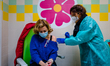 A lady belonging to the health staff is given the third dose of the anticovid vaccine at t...